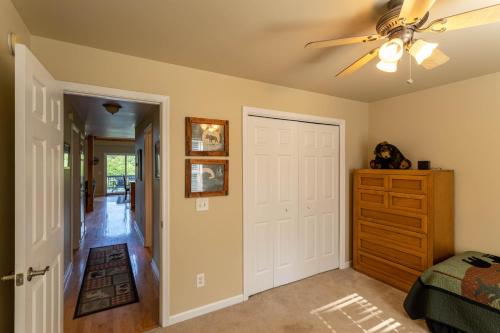 a bedroom with a ceiling fan and a closet at 4 Bears Lodge in Banner Elk
