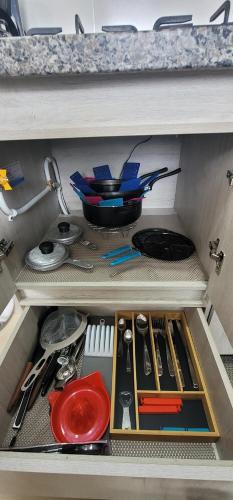 a drawer filled with utensils in a kitchen at APARTAMENTO en el QUINDIO in La Tebaida