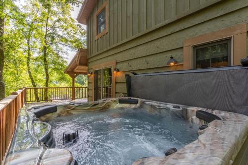 a hot tub on the back of a house at Moose Preserve in Sugar Grove