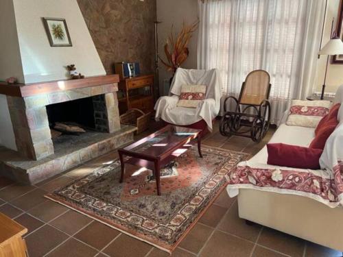 a living room with a couch and a fireplace at Cal Cuaresma in Isona