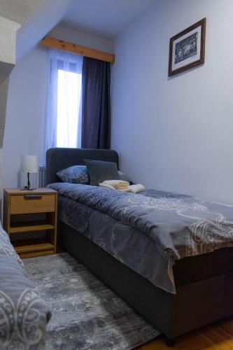 Postel nebo postele na pokoji v ubytování Vila MMBS