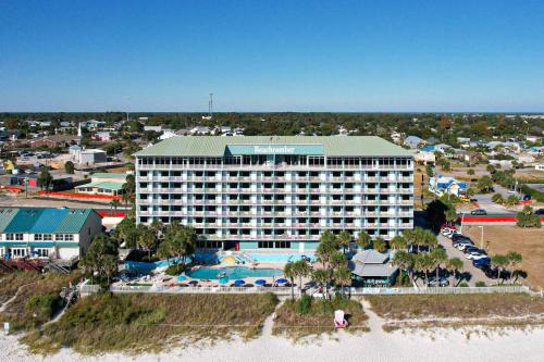 an aerial view of a resort with a swimming pool at Beachcomber Beachfront Hotel, a By The Sea Resort in Panama City Beach