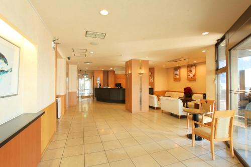 a lobby of a hospital with a waiting room at Chitose Airport Hotel in Chitose