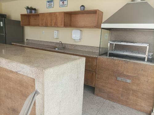 Una cocina o zona de cocina en Seu apartamento em Ilhéus