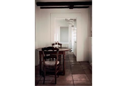a dining room with a table and chairs at Albergo Diffuso Crispolti in Labro Rieti