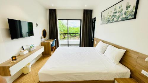 Ένα ή περισσότερα κρεβάτια σε δωμάτιο στο The Track Homestay - Near Bai Dai Beach