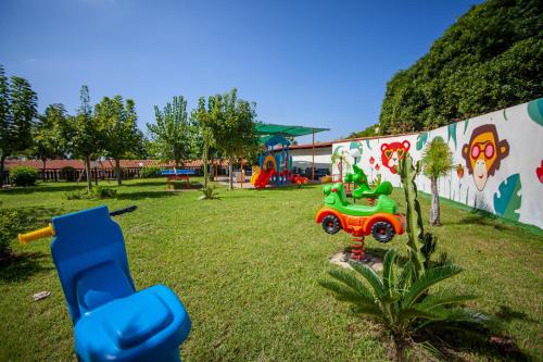 a park with a playground with a toy truck at Villaggio Baia D'Ercole in Capo Vaticano