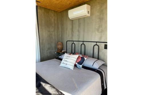 Ένα ή περισσότερα κρεβάτια σε δωμάτιο στο Casa de Vidro