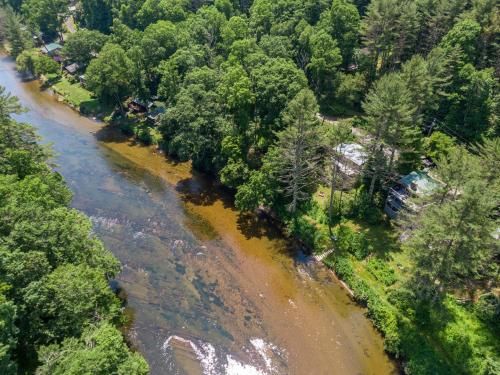 an aerial view of a river with trees at Knotty Pine in West Jefferson