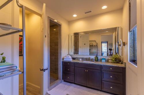 a bathroom with a sink and a large mirror at Maynard Rocks IV at Elk Creek in Banner Elk