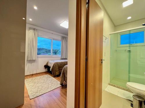 Koupelna v ubytování Apartamentos VENTURA a 5 min do CENTRO by Achei Gramado