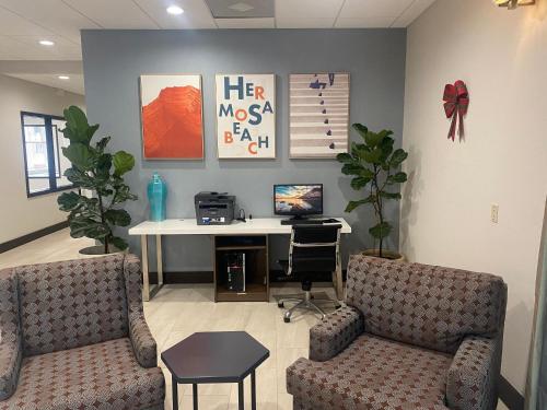 a doctors office with a desk and a computer at Holiday Inn Express Hotel & Suites Hermosa Beach by IHG in Hermosa Beach
