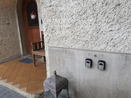 a building with a wall with two plates on it at Traditional Swiss-Flat in Interlaken