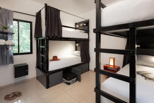 Che Tulum Hostel & Bar Adults Onlyにあるベッド