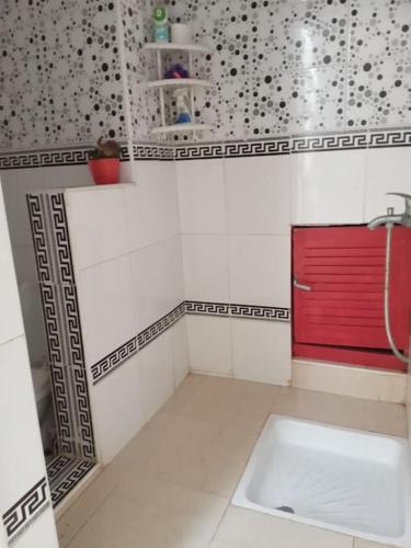 a bathroom with a sink and a red cabinet at Dar bouazza in Casablanca