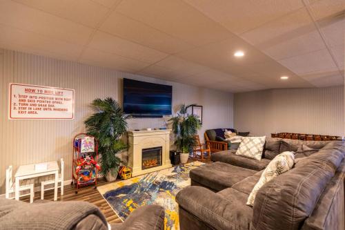 a living room with a couch and a fireplace at Seven Devils Sunrise in Seven Devils