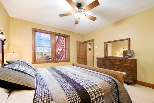 a bedroom with a bed and a ceiling fan at Wisp'd Away in Swanton