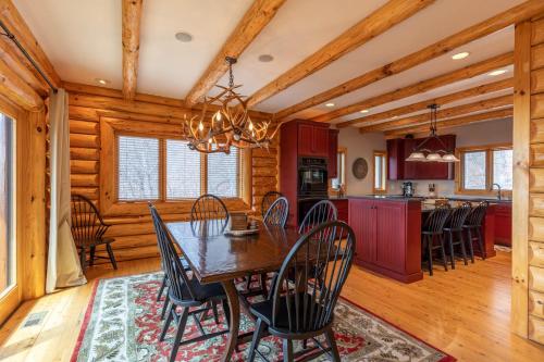 a dining room and kitchen with a table and chairs at Good Day Sunshine in Lenoir