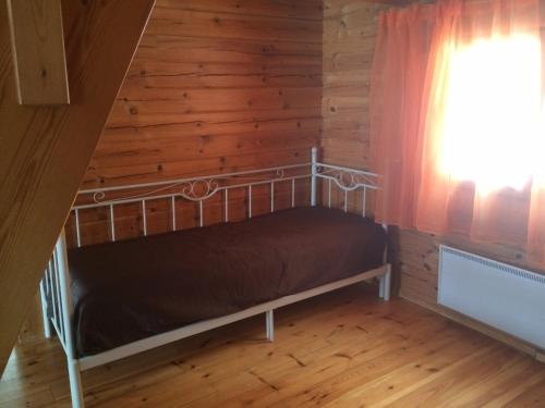 Vuode tai vuoteita majoituspaikassa Koljonvirran Kartano