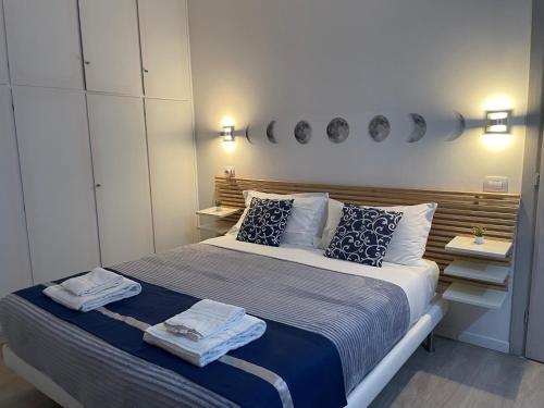 a bedroom with a bed with two towels on it at Residenza Borgo Trento SUNDAY in Verona
