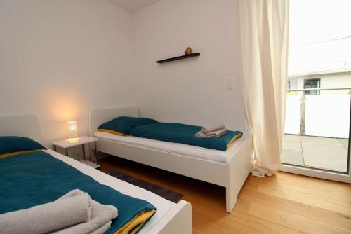 A bed or beds in a room at Modern Balcony Apartment with free Parking