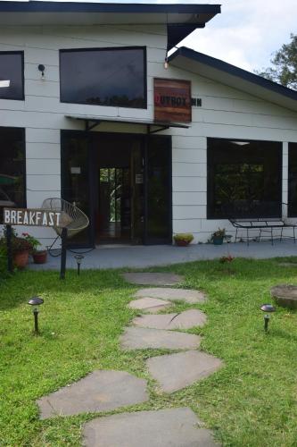a building with a sign that reads breakart art at OutBox Inn in Monteverde Costa Rica