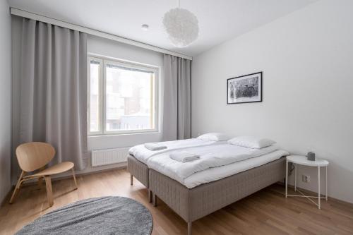 Postelja oz. postelje v sobi nastanitve 2ndhomes Tampere "RANTA" apartment - Sauna & Lake View