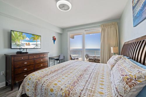 a bedroom with a bed and a view of the ocean at Laketown Wharf! Sleeps 9 - Resort Beach Condo, Stunning Ocean Views! by Dolce Vita Getaways PCB in Panama City Beach