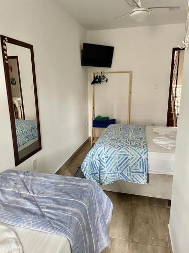 Una cama o camas en una habitación de Hostel Luz
