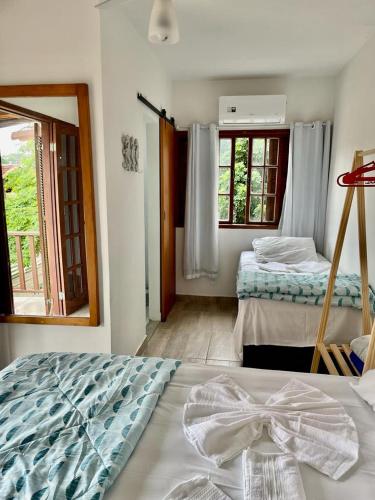 Una cama o camas en una habitación de Hostel Luz