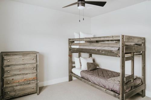 a bedroom with a bunk bed and a dresser at The Circle Unit B in Bozeman