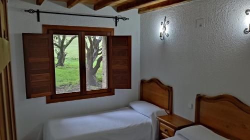 Postel nebo postele na pokoji v ubytování Casa Rural Ropino