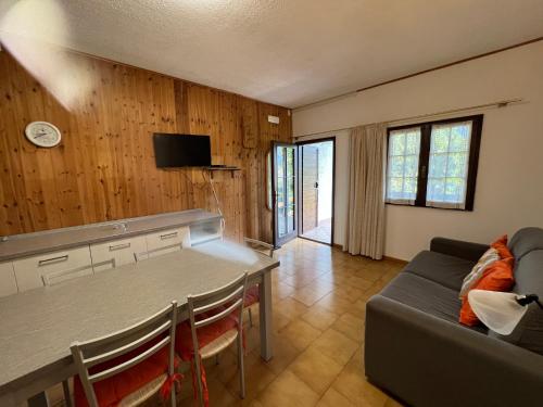 a living room with a table and a couch at Apartment in Ledro - Ledrosee 43436 in Ledro