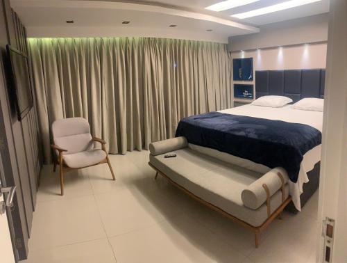 En eller flere senge i et værelse på Mansão Fragata