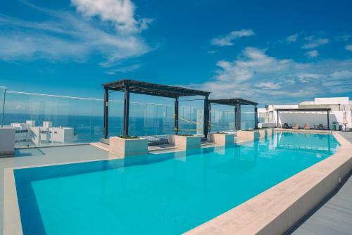 a swimming pool on the roof of a building at Resort de Reserva del Mar in Santa Marta