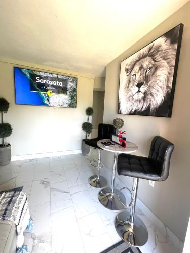 a waiting room with a table and a lion on the wall at 3 miles to Siesta Key #1 Beach in America in Sarasota