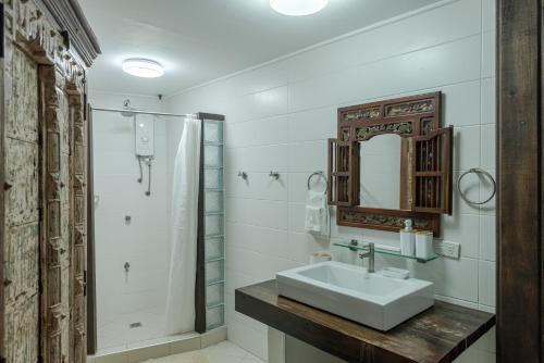 a bathroom with a sink and a shower at Chema's by the Sea in Samal