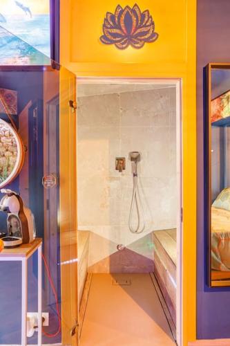 a bathroom with a shower in a room at JADE Hammam & Jacuzzi in Brie-Comte-Robert
