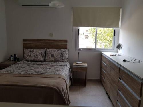 Una cama o camas en una habitación de Confortable departamento con cochera, hasta 4 personas