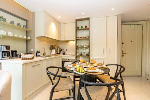 a kitchen with a table with food on it at Acibademflat in Istanbul