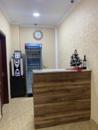 a drink machine with a christmas tree on the counter at Hotel LU-MA in Tbilisi City