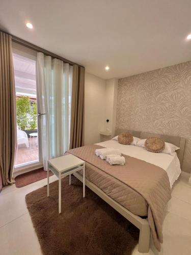 a bedroom with a bed with two towels on it at B&B Toci in Volla