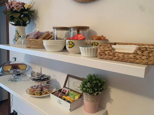 a shelf with food and other items on it at Colle Veralli in Foce