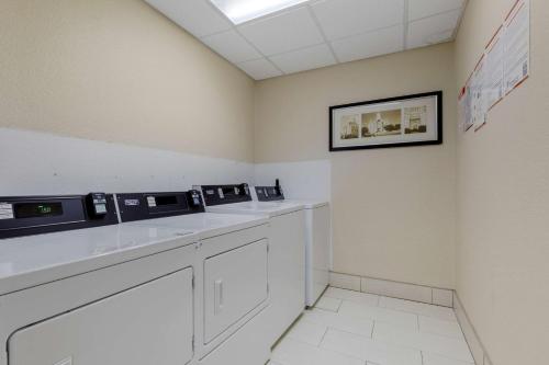 a waiting room with three microwaves on a counter at Comfort Suites Waco North - Near University Area in Waco