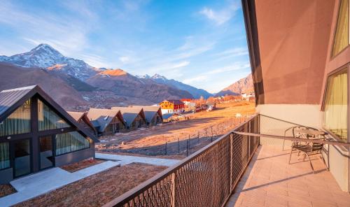 a balcony with a view of the mountains at Kazbegi View Cottages in Stepantsminda