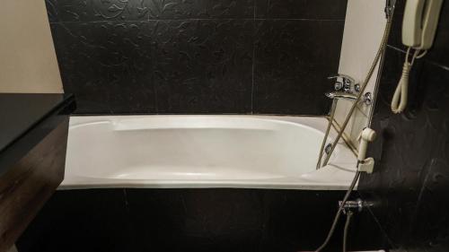 Ein Badezimmer in der Unterkunft Hotel Centre Point
