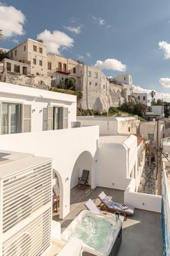 a balcony of a house with a view of a city at Mariet Naxos Elegant Suites in Naxos Chora
