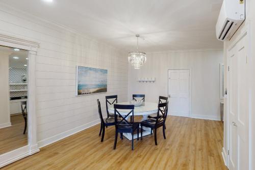 a dining room with a table and chairs at Village of South Walton EB210 in Rosemary Beach