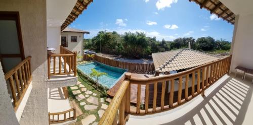 a view from the balcony of a house with a swimming pool at Barra Grande Villa Uluwatu 104 in Barra Grande