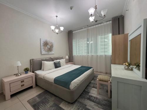 a bedroom with a large bed and a bathroom at Two Continents Holiday Homes - In the heart of Dubai Marina -Free Airport Pick-up in Dubai